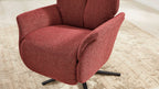 Roter, gepolsterter Lounge-Sessel mit strukturierter Stoffoberfläche und schwarzem Drehsternfuß auf hellem Teppichboden.