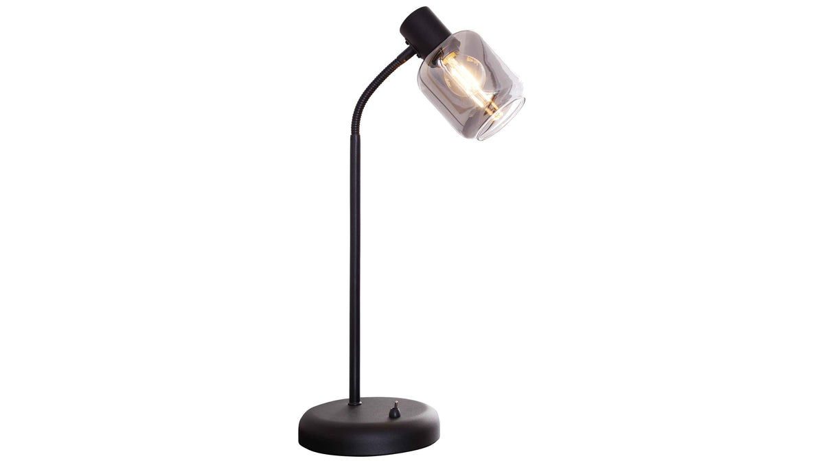 Schwarze Tischlampe mit rundem Sockel, schlankem Schaft, flexiblem Gelenk und rauchfarbener Glasfassung mit sichtbarer Leuchtfadenbirne.