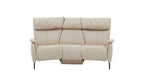 Beige Couch mit hoher Rückenlehne, weichen Kissen und seitlichen Armlehnen auf schlanken, schwarzen Metallfüßen.