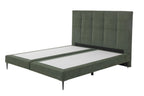 Boxspringbett mit moosgrünem Bezug und schwarzen Metallfüßen