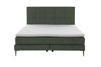Boxspringbett mit moosgrünem Bezug und schwarzen Metallfüßen