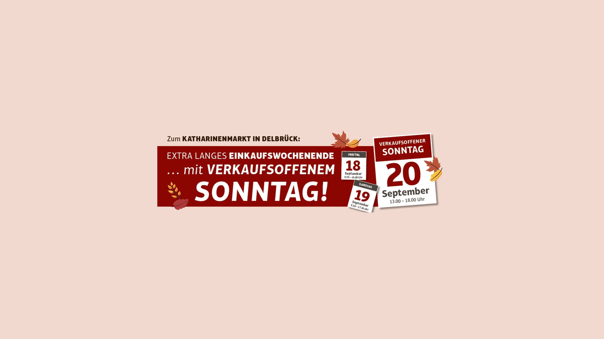 Ein rotes Banner in deutscher Sprache wirbt für ein Einkaufswochenende mit Sonntagsöffnung am 20. September und ist mit Herbstblättern verziert.